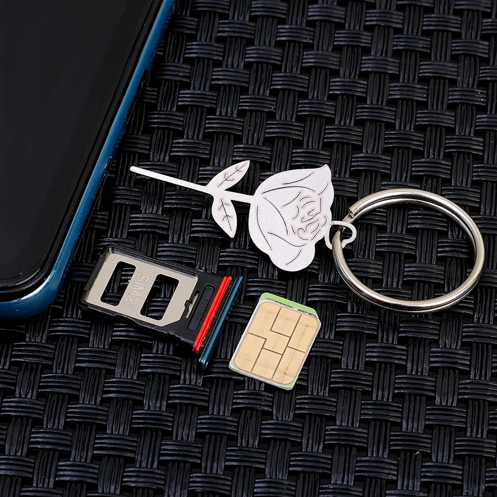 Rose Shape สแตนเลสการ์ดเข็มแบบพกพา Anti Lost โทรศัพท์มือถือซิมการ์ดถาดกําจัด Eject Pin พวงกุญแจ