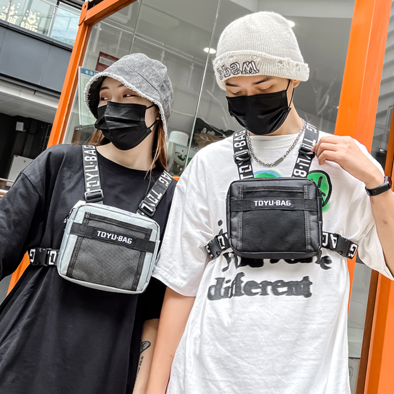 Bolsa de pecho de nailon ajustable para hombre y mujer, riñonera informal de estilo Hip Hop, con bolsillo frontal