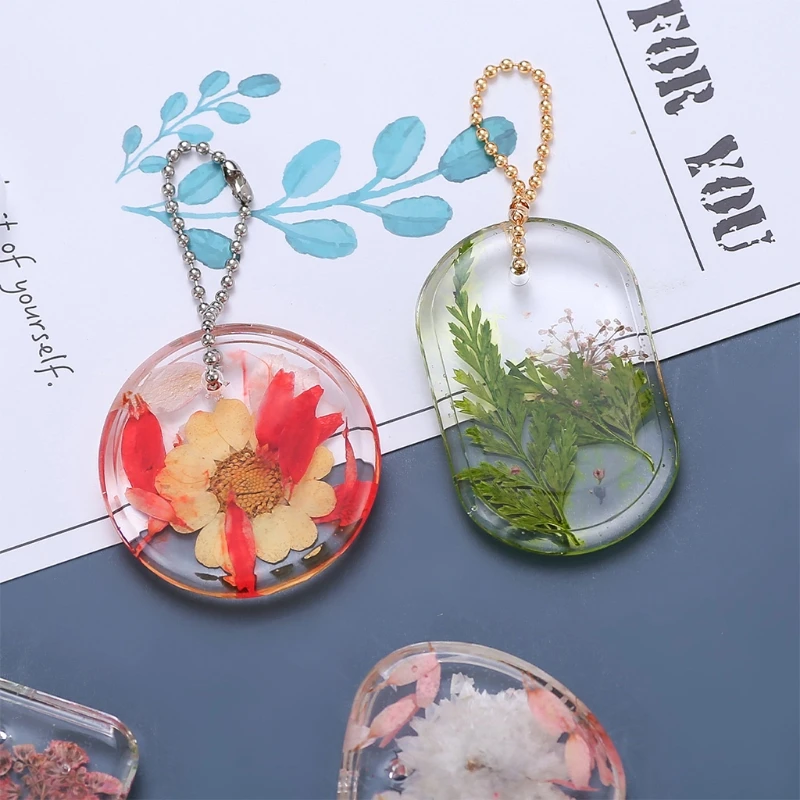 แม่พิมพ์เรซินอีพ็อกซี่ที่แขวนอยู่ในรายการ DIY เรซินคริสตัล UV แม่พิมพ์ซิลิโคนพรุน
