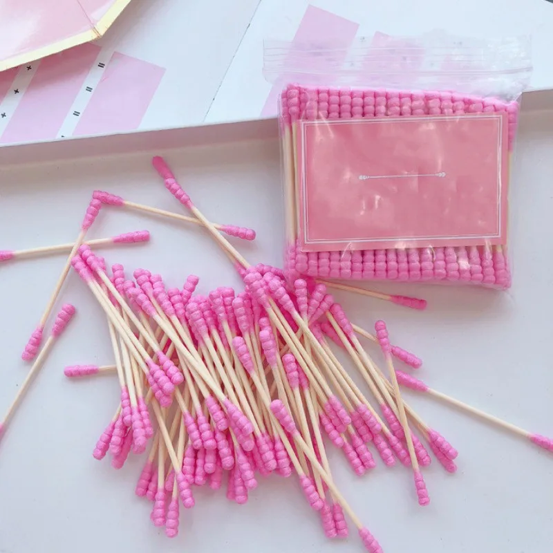 Hisopo de algodón desechable de doble cabeza para mujer, palo de algodón en espiral de colores para recoger las orejas, producto de higiene para el hogar, 100 piezas