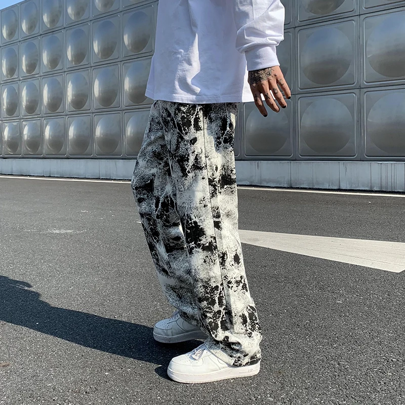 Pantalones vaqueros estampados Unisex cintura elástica primavera 2025 pantalones para fregar pantalones vaqueros moda para hombre estilo coreano High Street pantalones sueltos de Hip Hop