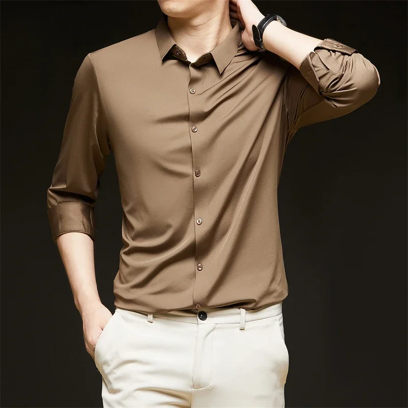 Nueva camisa informal de negocios de manga larga de Color sólido para hombre, resistente a las arrugas, cómoda, versátil para todas las estaciones