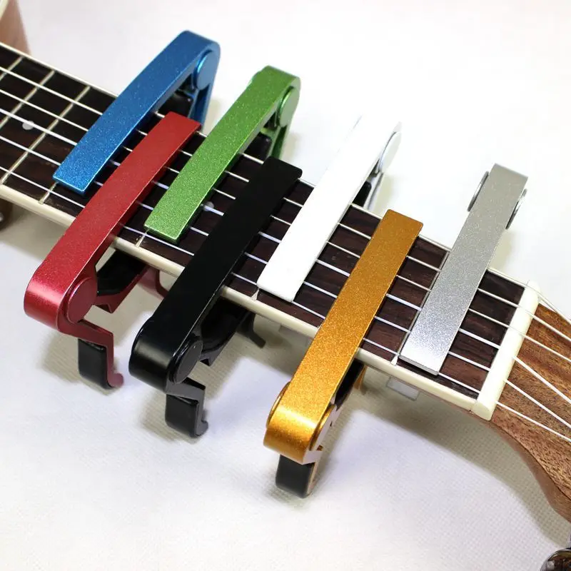 อลูมิเนียมคุณภาพสูงโลหะใหม่กีตาร์ Capo เปลี่ยน CLAMP Key อะคูสติกกีตาร์คลาสสิก Capo สําหรับปรับโทนเสียง