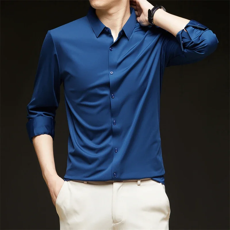Nueva camisa informal de negocios de manga larga de Color sólido para hombre, resistente a las arrugas, cómoda, versátil para todas las estaciones
