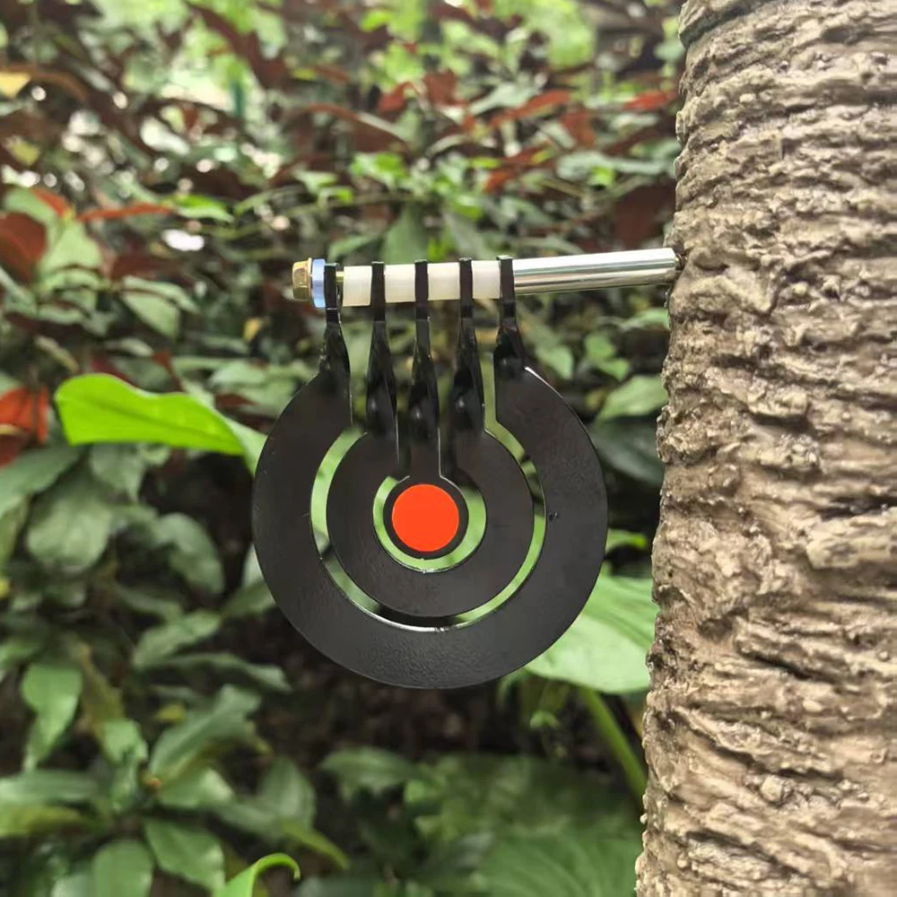 Shooting practice with a three - ring tree - inserted rotating pendulum target made of 3 - millimeter - thick metal
