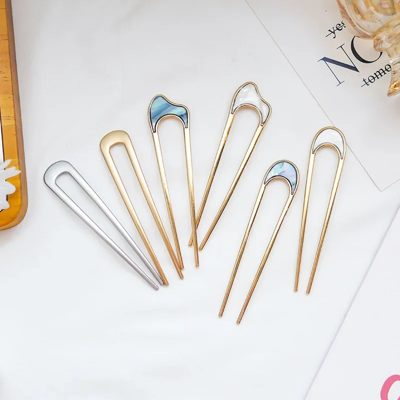 Dames gebruiken elegante schelpglazuurde hoorns in goud en zilver, modieuze, U-vormige metalen haarspelden, haaraccessoires en hoofddeksels