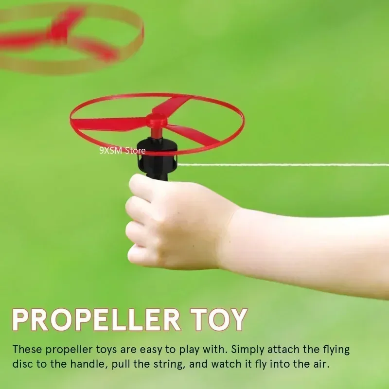 1pc 子供プルストリングフライングディスクプロペラヘリコプター屋外おもちゃ楽しいゲームスポーツフライングスピントップ子供の開発おもちゃ