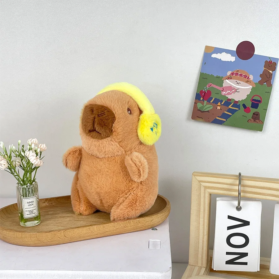 Lindo capibara con auriculares juguete para niños cubierta para la cabeza muñeca capuibala llavero colgante suave muñeco de peluche pareja llavero regalo