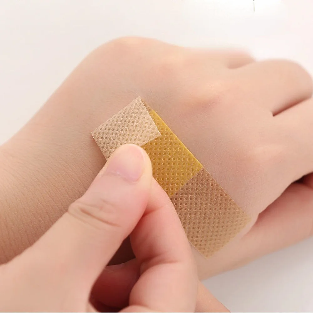 50pcs กันน้ําบาดแผลแพทช์เทป Self-Adhesive พลาสเตอร์ผ้าพันแผลผ้าไม่ทอ Band Aid สําหรับเด็ก
