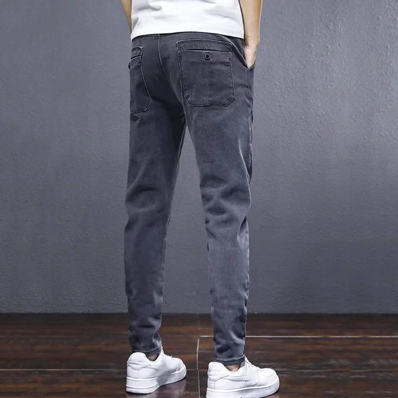 Pantalones vaqueros con cintura elástica para hombre, Pantalón cómodo de felpa, térmico, Harem, a la moda, pierna estrecha, color gris, otoño e invierno, 2024