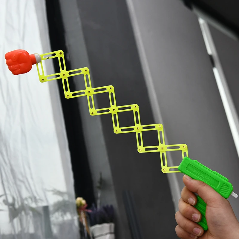 Retractable Fist Shooter Trick ปืนของเล่นตลกเด็กพลาสติกปาร์ตี้เทศกาลของขวัญสนุกคลาสสิก Elastic Telescopic Fist ของเล่น