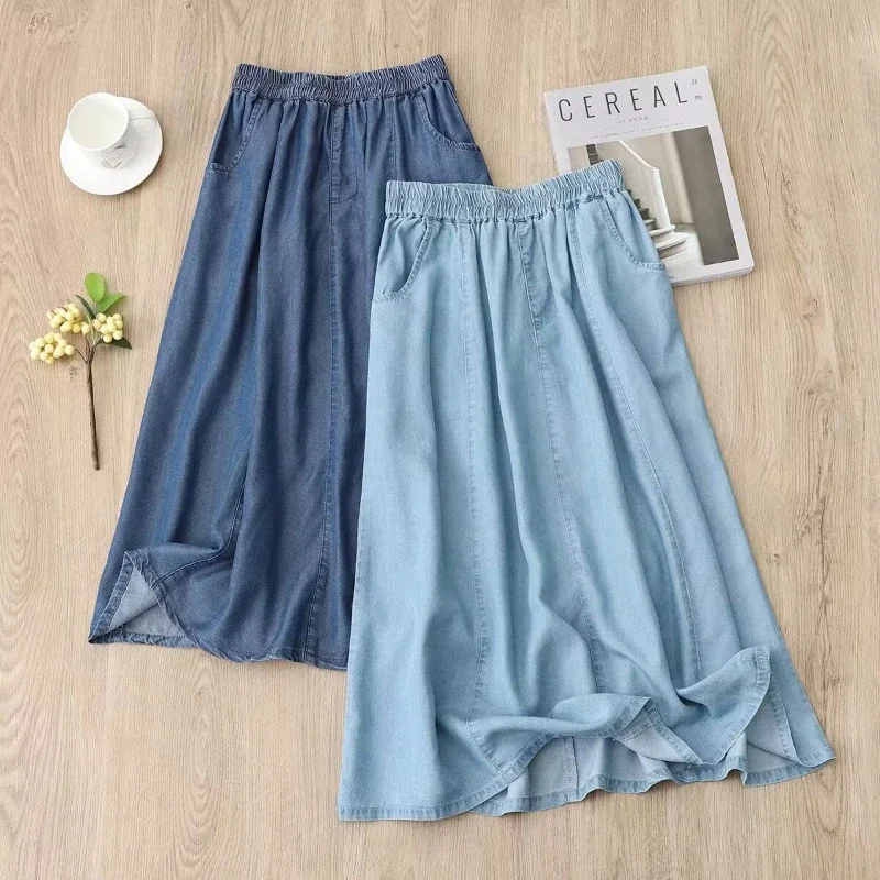 Faldas de mezclilla suaves para mujer, moda holgada, novedad de verano, falda acampanada elástica con cintura, diseño de bolsillo, faldas azules de longitud media para mujer