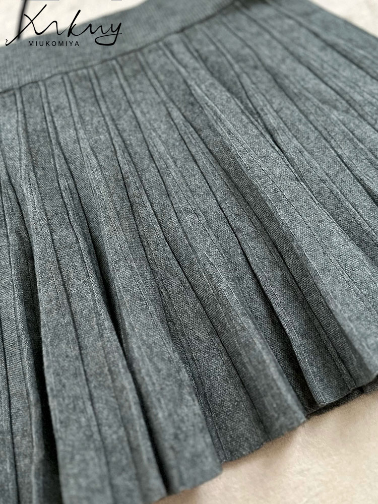 MiuKoMiYa สีเทากระโปรงผู้หญิงจีบกระโปรงมินิฤดูใบไม้ร่วงสูงเอวยาวถักกระโปรงผู้หญิงสีดํากระโปรงสั้นสุภาพสตรี