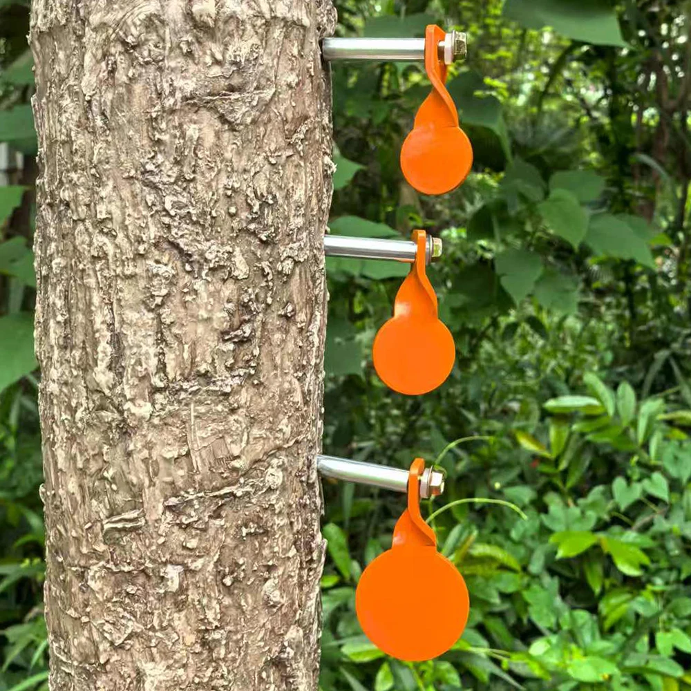 Um conjunto de três alvos de inserção de árvore de metal para prática de tiro com diâmetros de 4 cm, 3 cm e 2,5 cm respectively.
