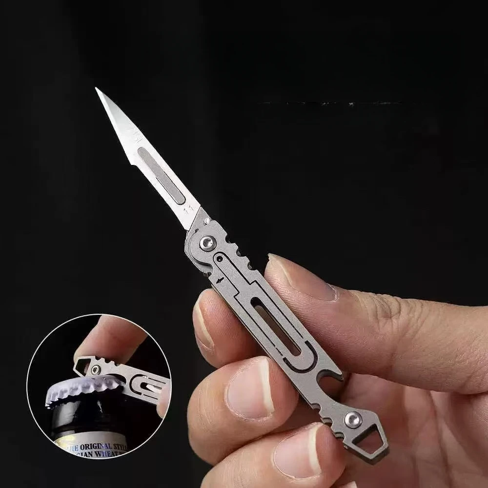 Nuevo Mini cuchillo quirúrgico plegable de aleación de titanio, cuchillo EDC portátil para acampar al aire libre, viene con 10 Uds de cuchillas gratis