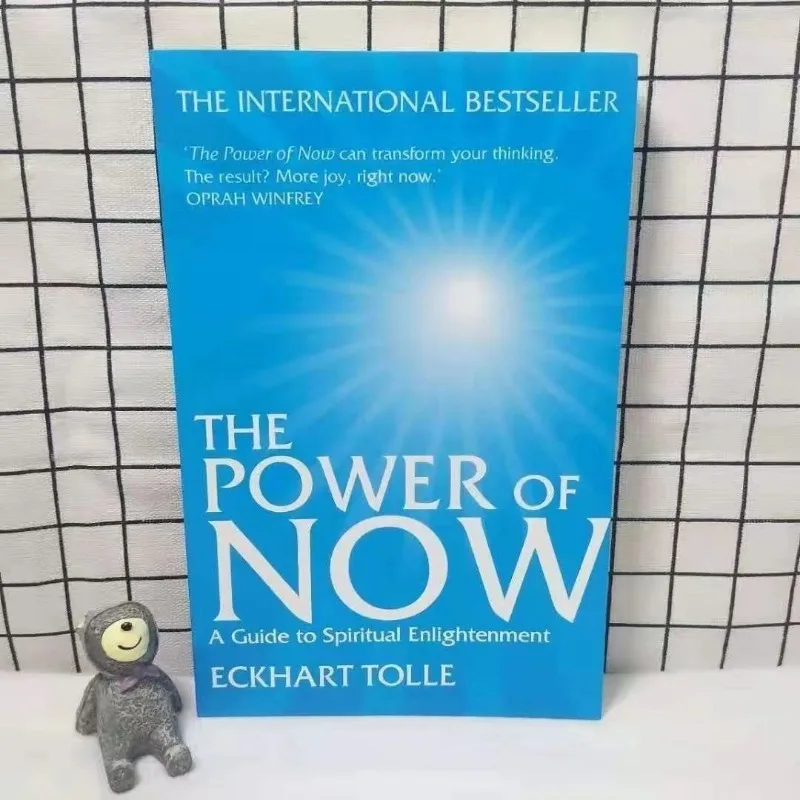 พลังของตอนนี้โดย Eckhart tolle แนวทางในการตรัสรู้ทางจิตวิญญาณหนังสือภาษาอังกฤษที่สร้างแรงบันดาลใจให้กับเยาวชนที่ประสบความสำเร็จหนังสือแรงจูงใจ