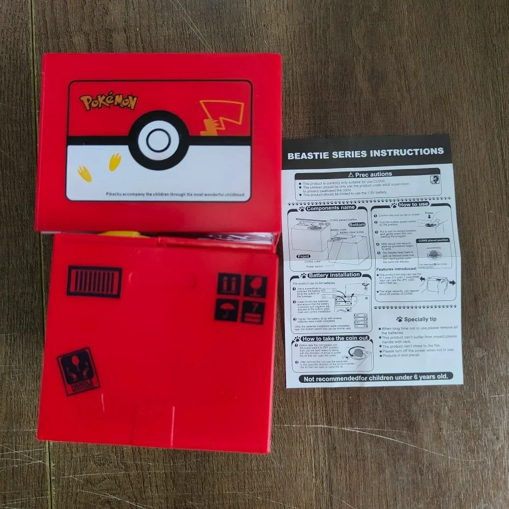 Pokemon Pikachu Piggy Bank Action รูปอะนิเมะการ์ตูนอิเล็กทรอนิกส์กล่องเงินพลาสติกขโมยเหรียญ Piggy Bank เด็กของขวัญของเล่นคริสต์มาส