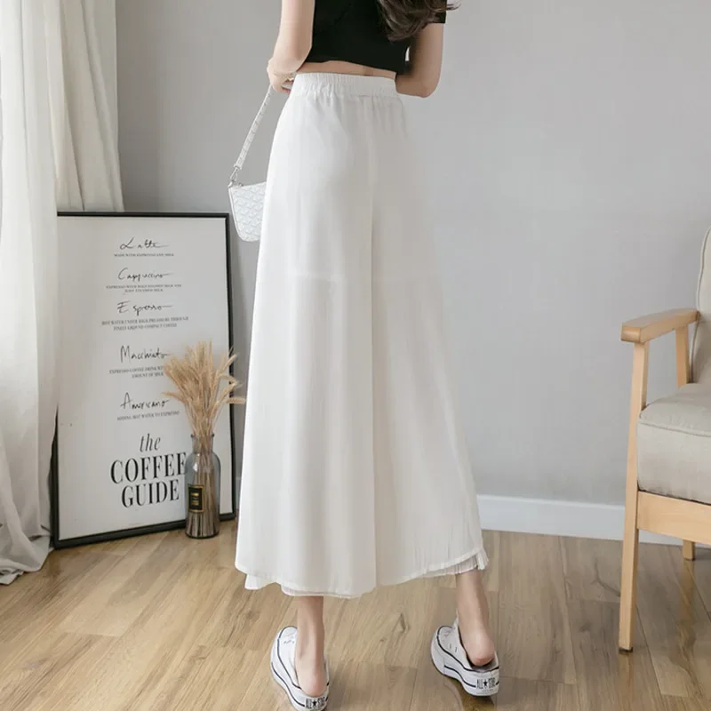 Calça elástica de perna larga feminina, culottes irregulares de bainha, camada dupla, calça coreana casual solta plissada de verão
