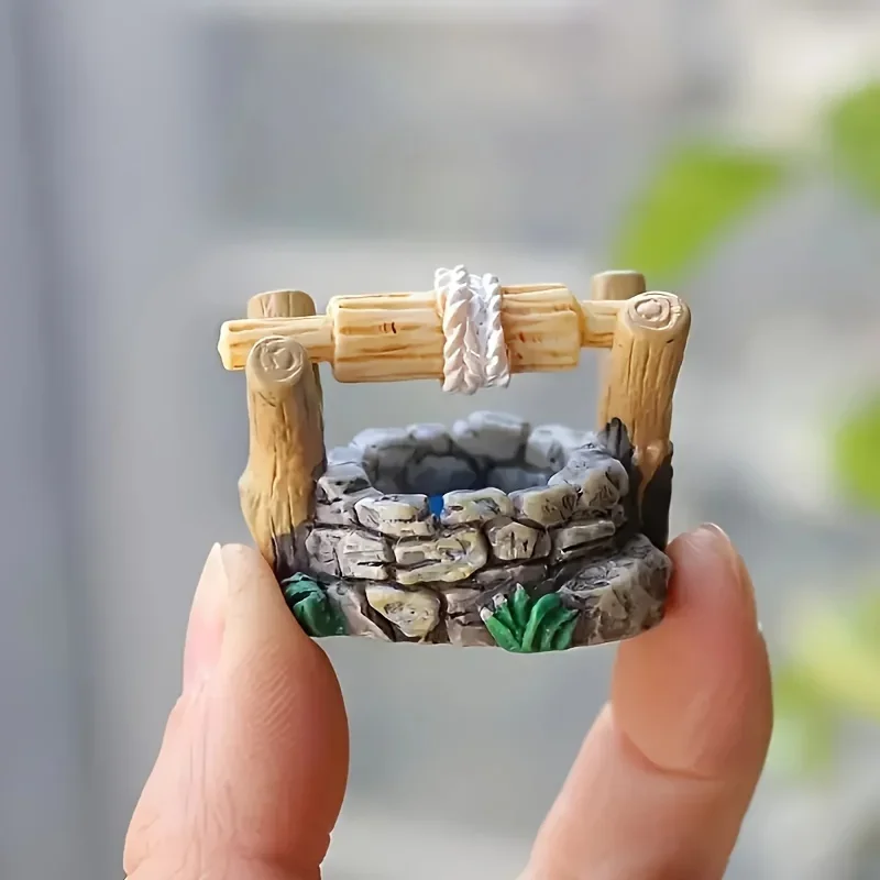 Una statua in miniatura del pozzo del paese delle meraviglie - Collezione in resina fatta a mano con micro decorazione paesaggistica