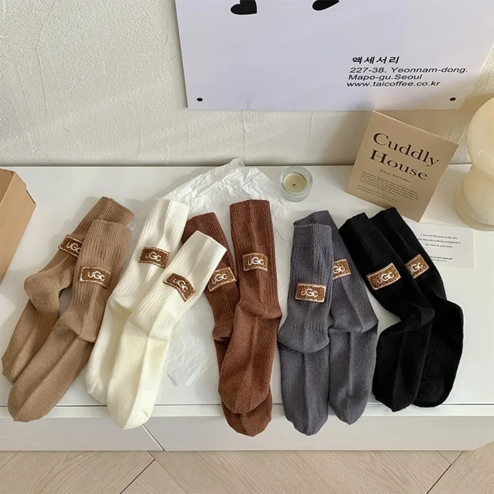 Ins กลางหลอดกลางถุงเท้าอุ่นถัก Snow Boot ถุงเท้าสีทึบส้น Furry ป้ายถุงเท้าผู้หญิงฤดูหนาว