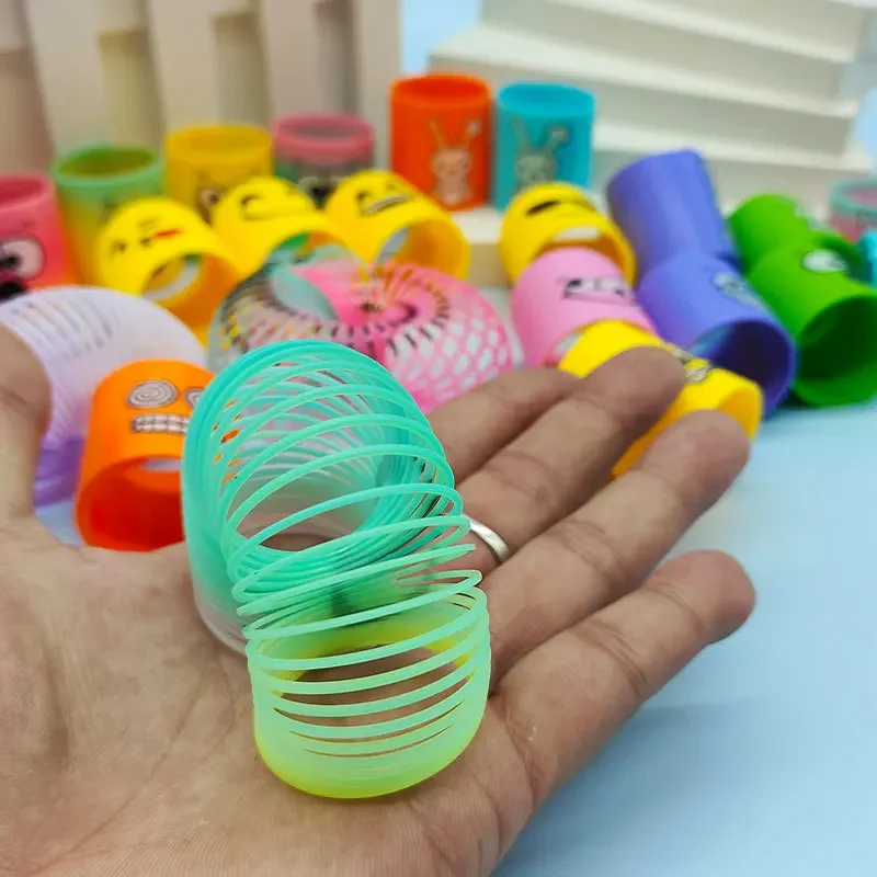12pcs Rainbow Circle Funny Magic ของเล่นเด็กการศึกษา COIL วงกลมที่มีสีสัน Telescopic Elastic Magic แหวนเด็กของขวัญตลก