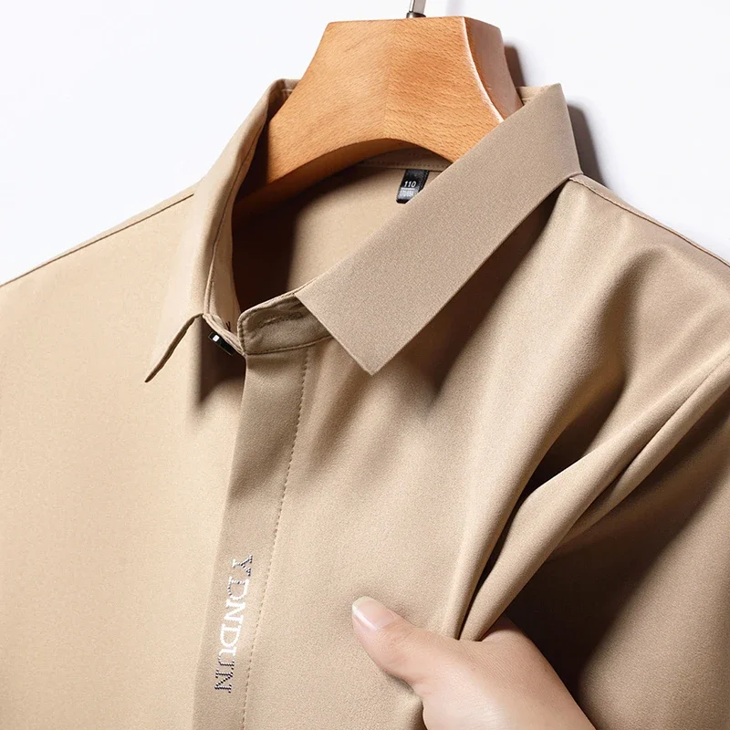 Camisa informal de negocios para hombre, camisa de manga corta de Color sólido, resistente a las arrugas, sin arrugas, Top versátil cómodo para todas las estaciones, nueva