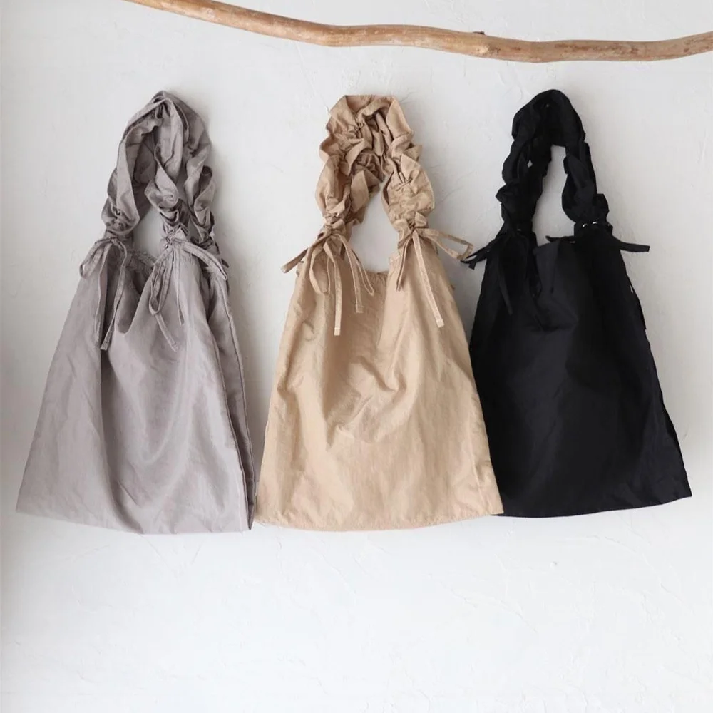 Cachellie Bolsa de ombro feminina autêntica vintage com cordão de nylon Dstring à prova d'água americana retrô com nó