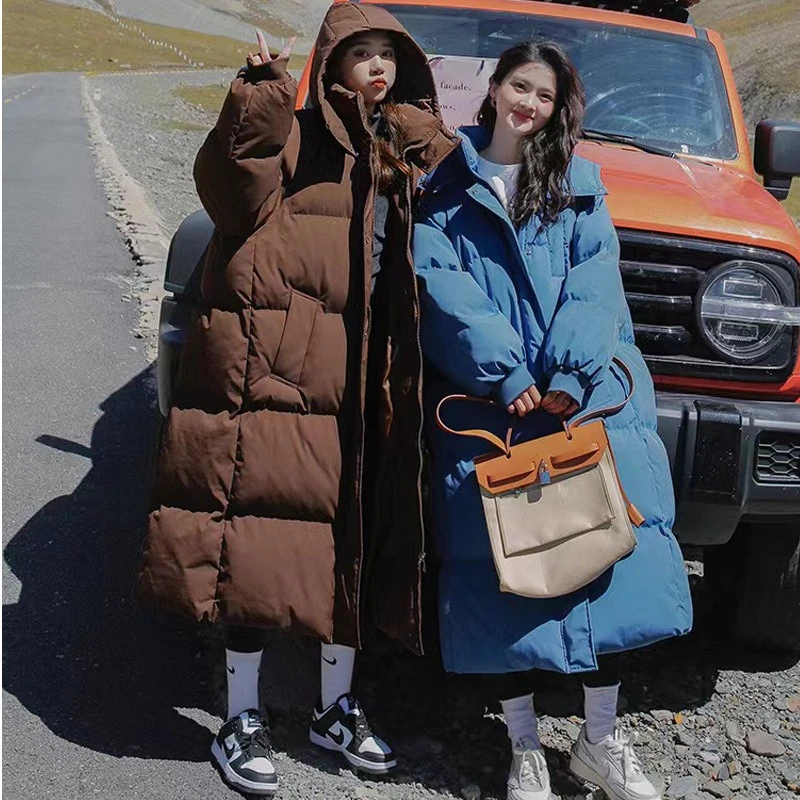 Longo engrossado para baixo algodão pão estilo casaco feminino inverno 2025 outerwear coreano solto longo na altura do joelho sólido jaqueta com capuz