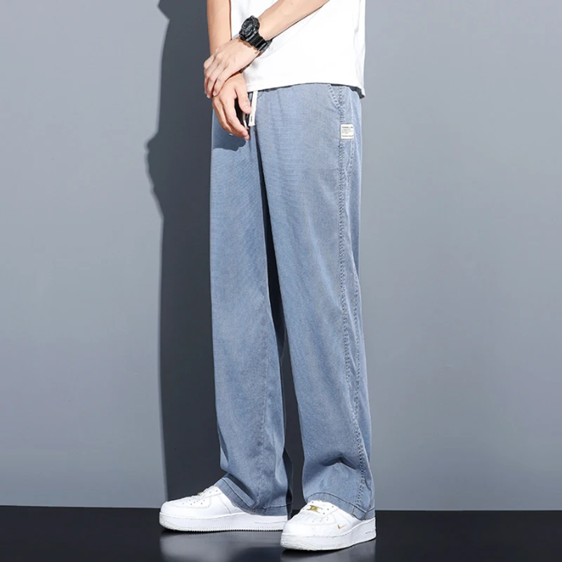 Pantalones vaqueros de tela Lyocell suave de verano para hombre, pantalones holgados de pierna recta con cordón en la cintura elástica, pantalones casuales coreanos de talla grande M-5XL