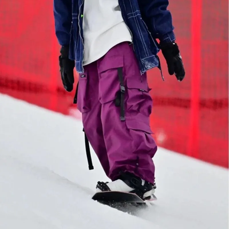 Warme violette Skihose für Damen und Herren, verdickte Skihose, wasserdichte amerikanische Schwerindustrie-Snowboardhose