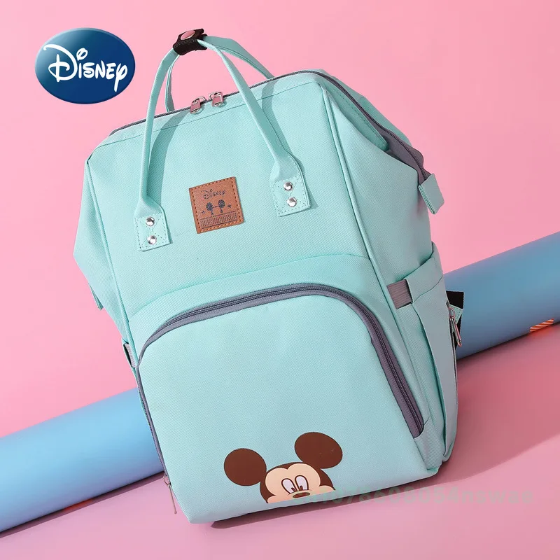 Disney's New กระเป๋าผ้าอ้อมกระเป๋าเป้สะพายหลังแบรนด์หรูกระเป๋าแฟชั่นเด็กการ์ตูนน่ารักกระเป๋าผ้าอ้อมเด็กขนาดใหญ่ความจุ Multi Function