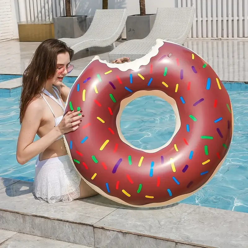 A thickened inflatable donut swimming ring - brown/pink printed - a floating ring for maximum comfort and fun