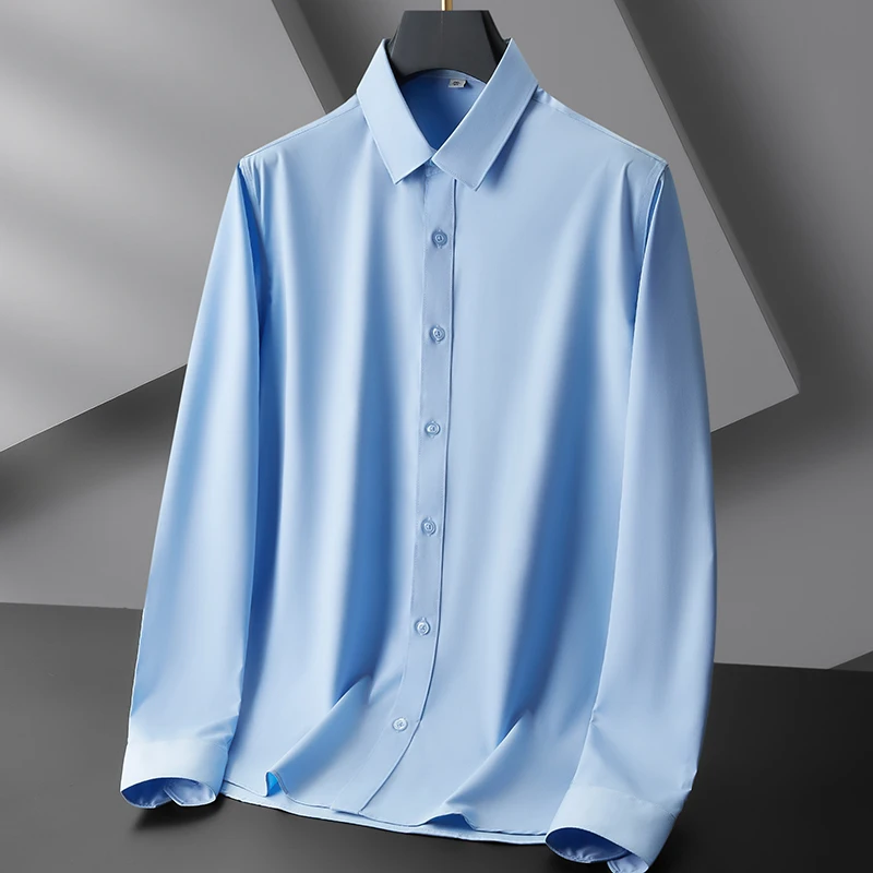 Nueva camisa informal de negocios de manga larga de Color sólido para hombre, resistente a las arrugas, cómoda, versátil para todas las estaciones