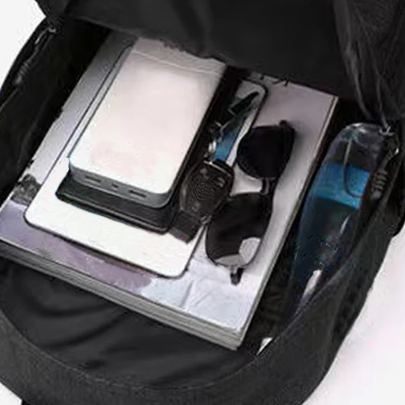 Zaino in stile neutro per ragazzi e ragazze, adatto per viaggi d'affari. Materiale in puro nylon nero, borsa a doppia spalla.