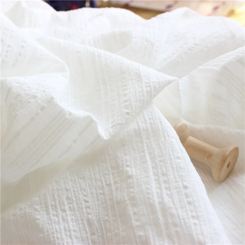 ผ้าฝ้าย 100% สีขาวสําหรับเย็บเสื้อผ้า วัสดุผ้าฝ้าย Poplin นุ่มและระบายอากาศได้ดีสําหรับการตัดเย็บเสื้อผ้า
