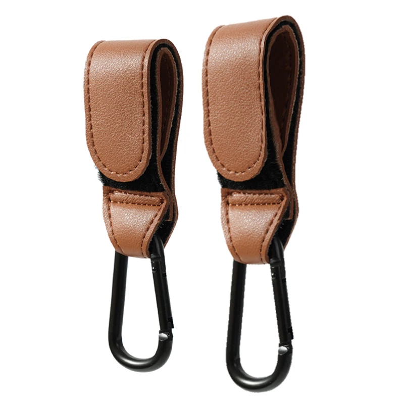 Gancho para cochecito de bebé, gancho ajustable de cuero PU a la moda, organizador de carrito, colgador de bolsa de pañales, accesorios de viaje para niños y niñas
