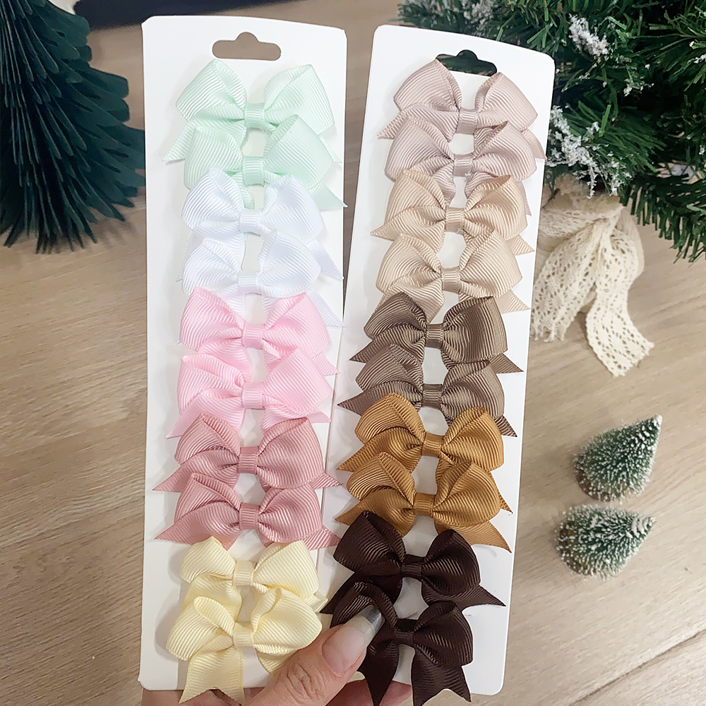 10 pz/set Colore Solido Per Bambini Archi Fermagli Per Capelli per Le Neonate Fatti A Mano Nastro Bowknot Tornante Barrettes Accessori Per Capelli di Capodanno