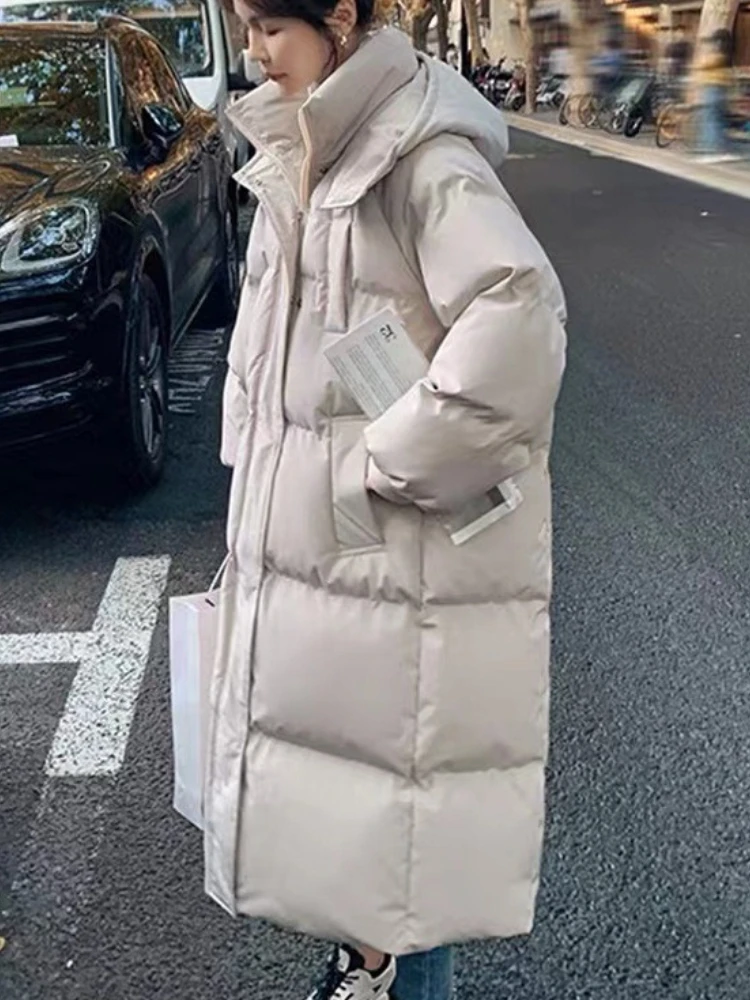 Longo engrossado para baixo algodão pão estilo casaco feminino inverno 2025 outerwear coreano solto longo na altura do joelho sólido jaqueta com capuz