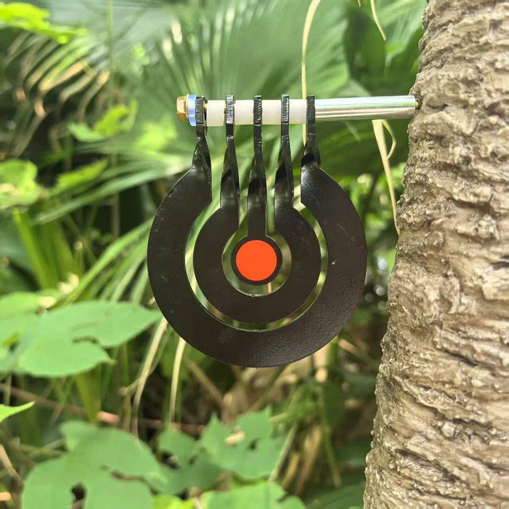 Shooting practice with a three - ring tree - inserted rotating pendulum target made of 3 - millimeter - thick metal