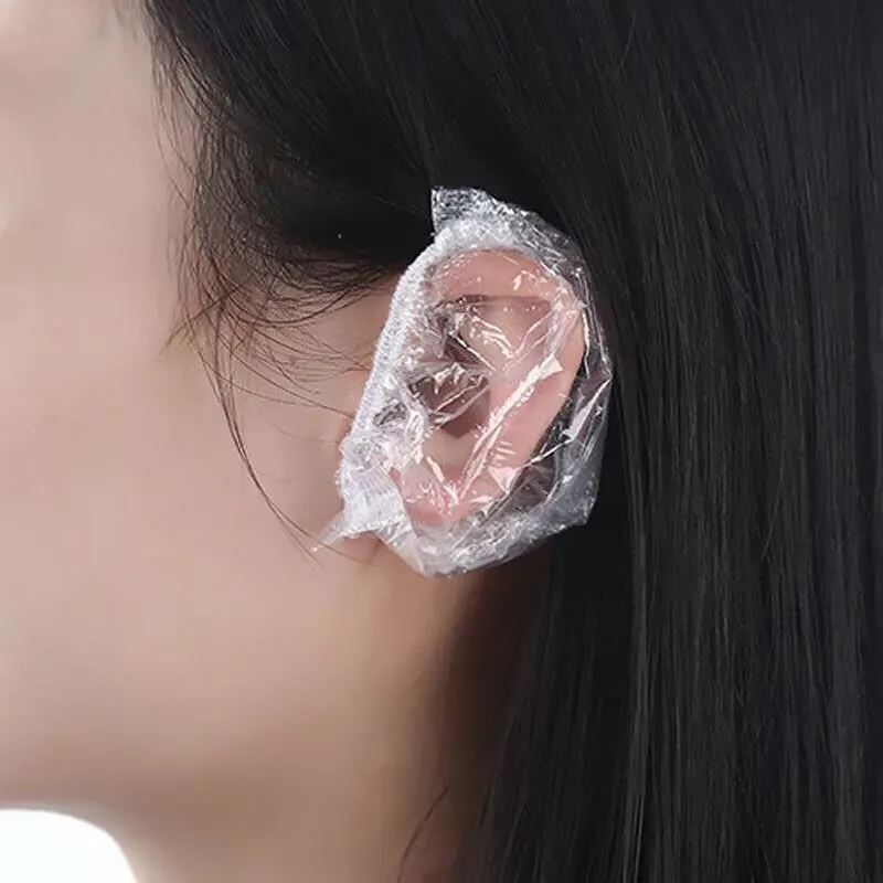 100 capas descartáveis impermeáveis dos ouvidos dos pces para a tintura de cabelo, envoltório plástico protetor dos protetores de orelha elásticos transparentes para o salão de chuveiro