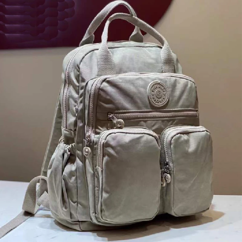 แฟชั่นผู้หญิงกระเป๋าเป้สะพายหลังไนลอนกันน้ํา Soft Handle Solid Multi-pocket Travel Zipper Feminina กระเป๋าแล็ปท็อปกระเป๋าเป้สะพายหลัง
