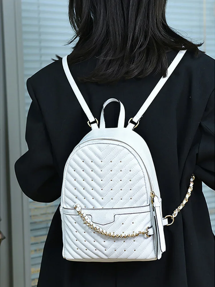 2025 Zaino da donna in PU moda zaino da viaggio scuola borsa a tracolla per il tempo libero con rivetti