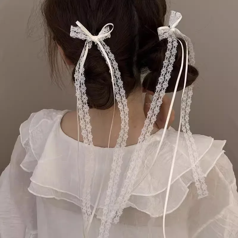 2 uds blanco dulce encaje lazo largo Clip de pelo mujeres niñas cinta borla Bowknot horquillas para el cabello pasadores trenzados tendencia ahueca hacia fuera sombreros