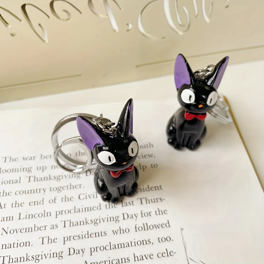 魅力的な黒猫キーホルダー - かわいいPVC製レディースファッションアクセサリー、バッグや鍵に最適、猫アクセサリー