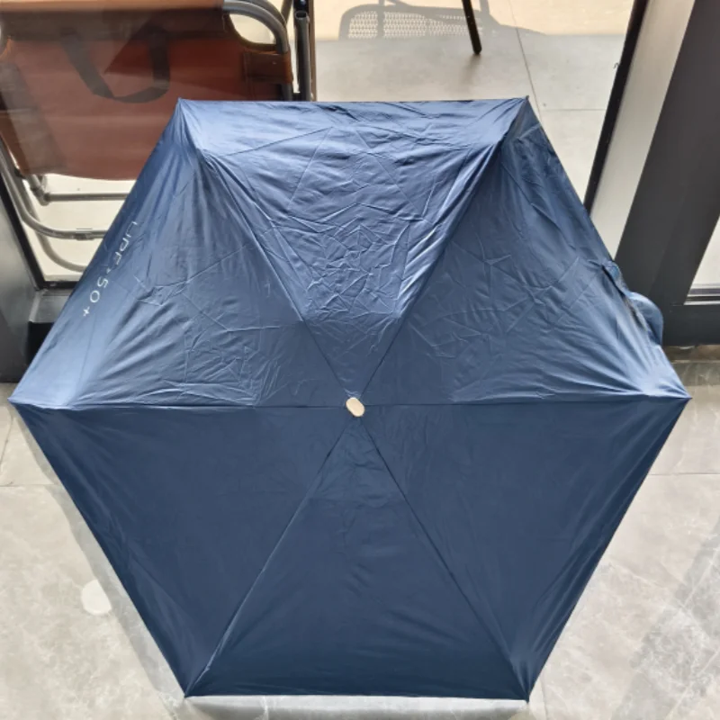 Mini sombrilla de bolsillo para lluvia, sombrilla de vinilo plegable con protección ultravioleta UV, parasol de bolsillo, cápsula, 1 ud.