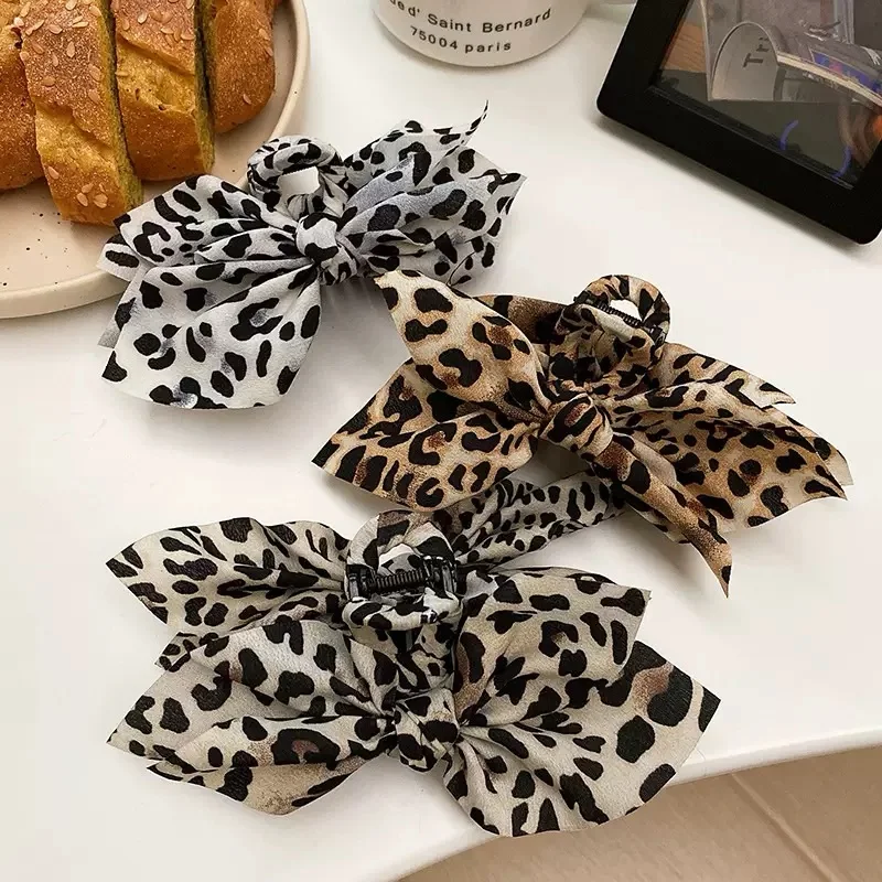 Accessori per capelli di fascia alta per donna con clip per fiocco su entrambi i lati in tessuto con stampa leopardata dal temperamento retrò