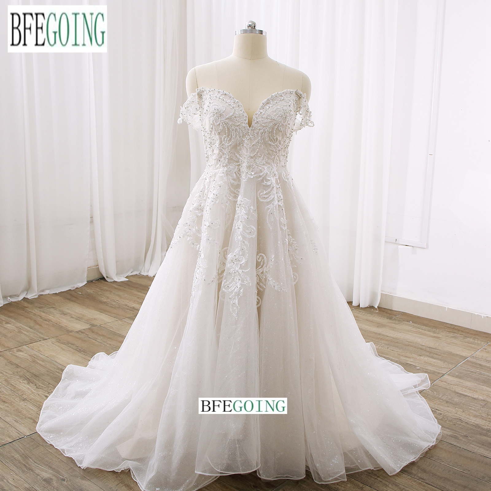 Abiti da sposa a trapezio in organza avorio Cappella Abiti da sposa con scollo a cuore su misura con spalle scoperte Tulle con perline