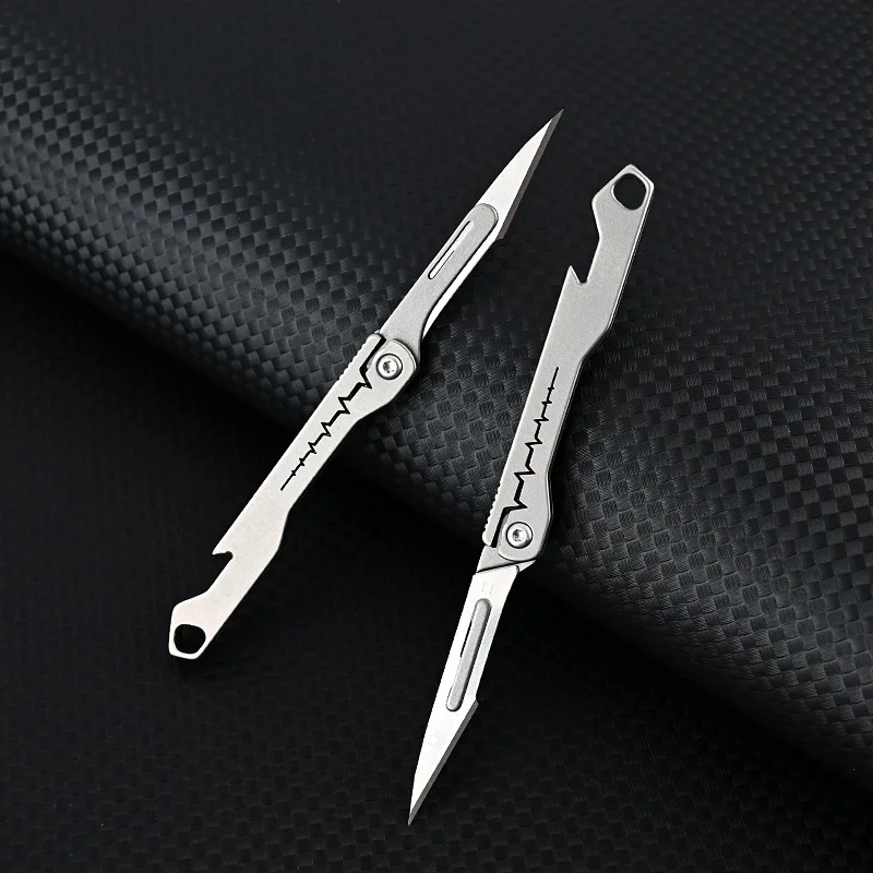 Nuevo Mini cuchillo quirúrgico plegable de aleación de titanio, cuchillo EDC portátil para acampar al aire libre, viene con 10 Uds de cuchillas gratis