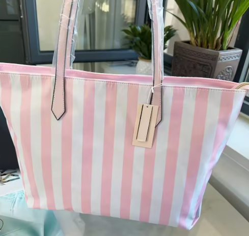 2025 Nuevo bolso de mano con firma rosa y tira, bolso de hombro para mujer