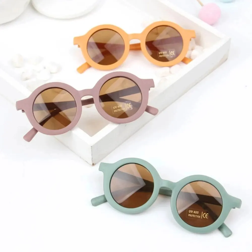 Gafas de sol con montura redonda para bebé, lentes de Color caramelo, protección UV de Color sólido, redondas y cómodas, estilo Retro, novedad
